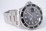 ROLEX STAINLESS STEEL SUBMARINER DATE 16610 w/ SERVICE PAPERS $8,250