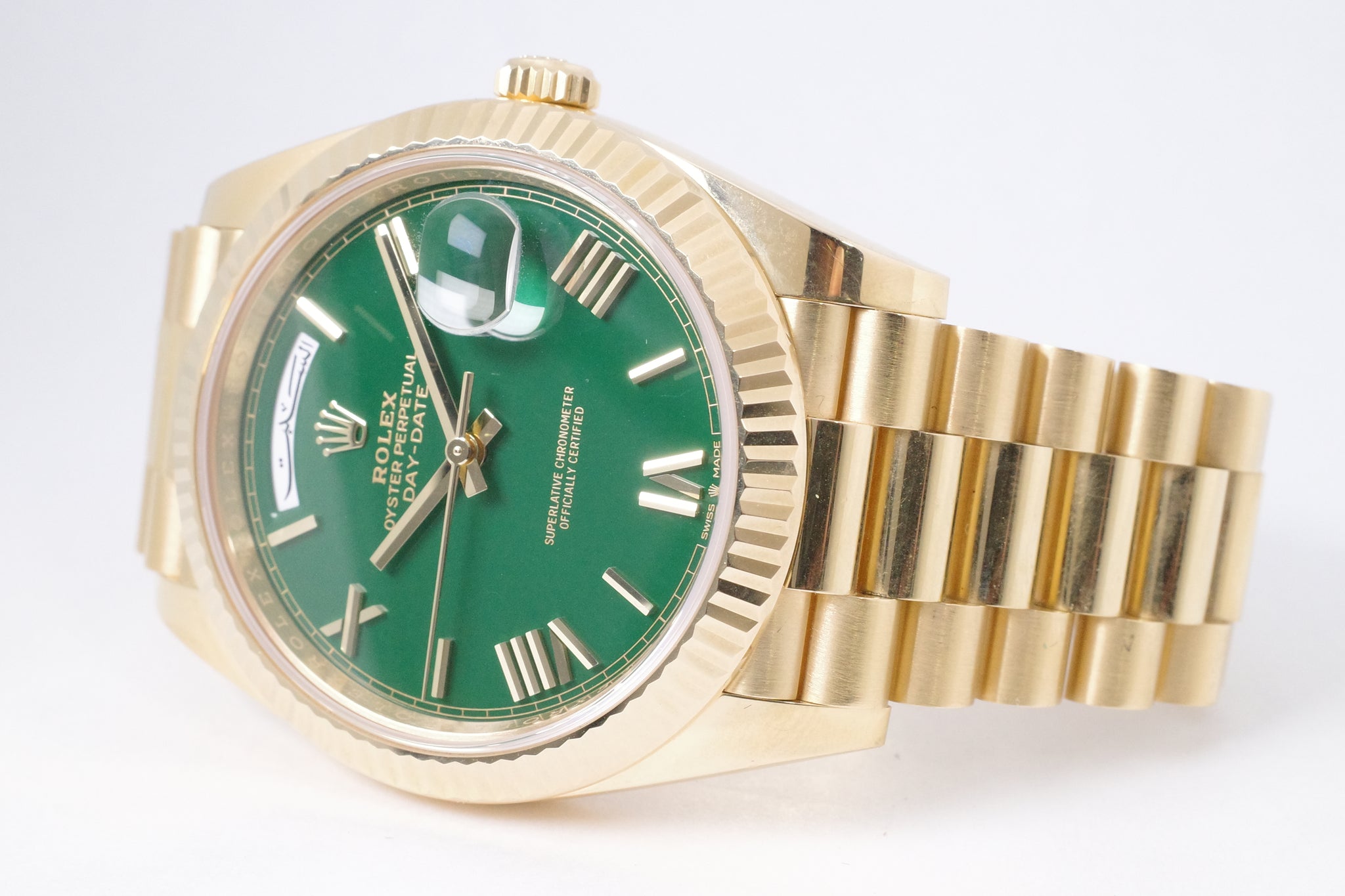 ROLEX 2023 YELLOW GOLD DAY-DATE 40 GREEN ROMAN DIAL ARABIC MIDDLE
